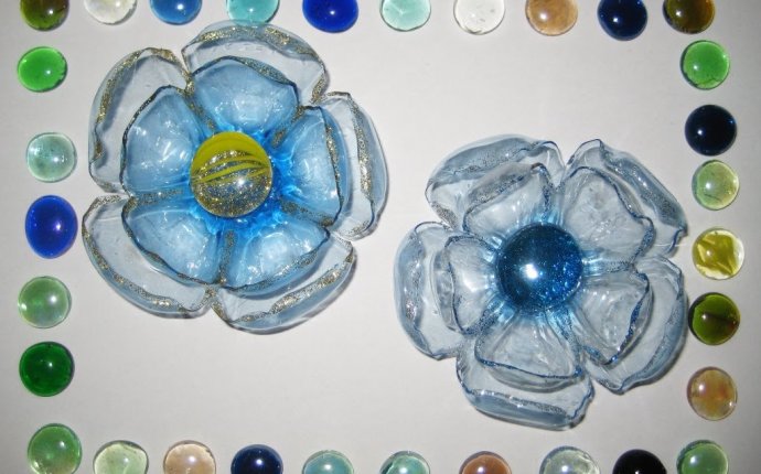 Hands from the Plastic bottles of flowers